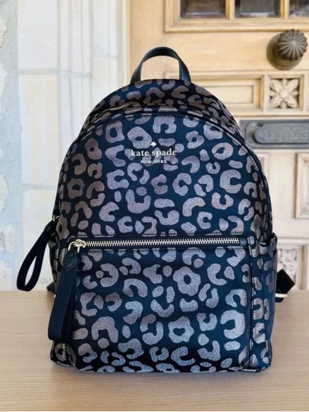 kate spade New York Chelsea black backpack with metallic silver leopard print